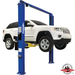 White Jeep Grand Cherokee lifted on a Forward Lift I10 2 post auto lift, ALI certified